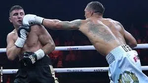 Oleksandr Usyk throwing punches — averaging ~28 jabs per round across heavyweight title fights