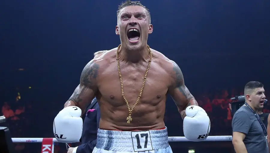 Oleksandr Usyk celebrates victory — WBC Heavyweight Champion, 22-0 unbeaten professional record